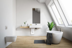 White attic bathroom interior with wooden floor, bathtub with rug near it, sink with narrow mirror and toilet. 3d rendering