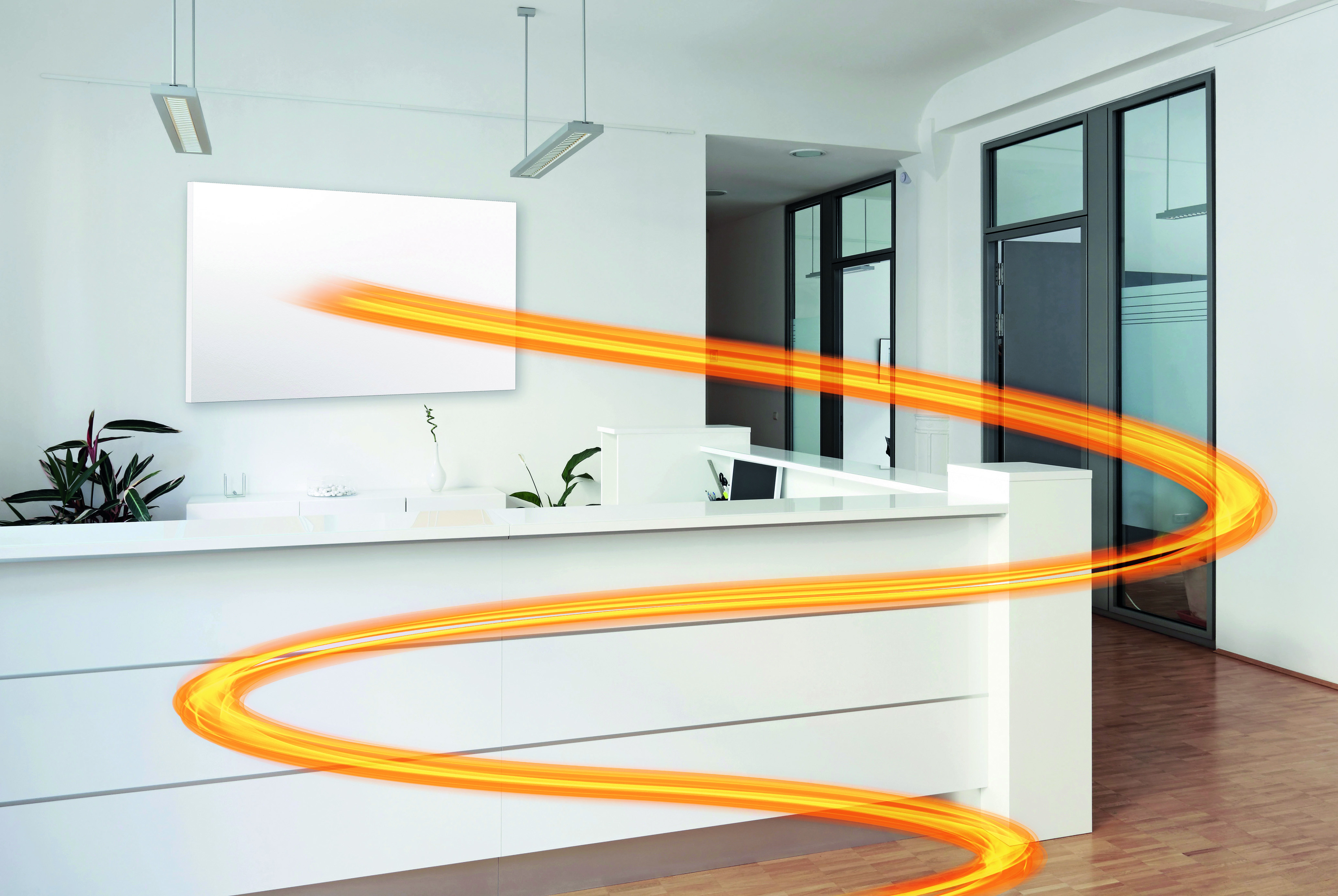 Moderne Bürofläche mit LAVA® Infrarotheizung von ETHERMA und sichtbarer Wärmewirkung für effiziente Beheizung im Objektbau.