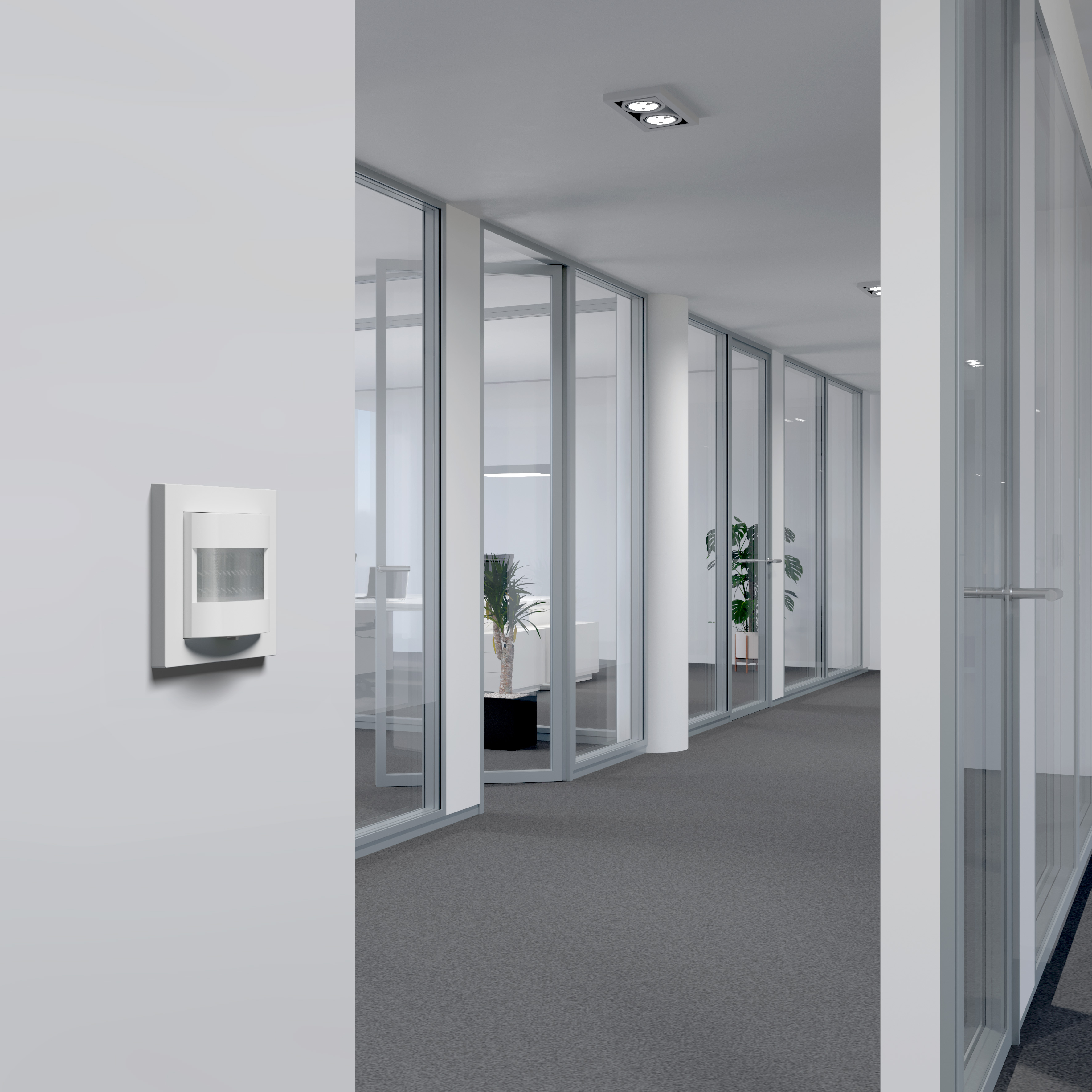 Präsenzmelder in einem modernen Büroflur mit automatisierter Beleuchtung.